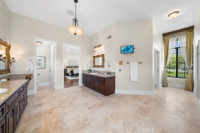 a large white kitchen with a large window