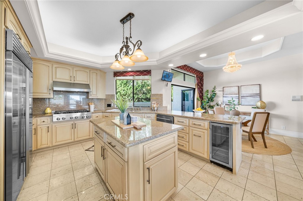 2487 Cliff Road Upland, CA 91784 - Photo 30 of 49 a kitchen with a stove cabinets and chairs