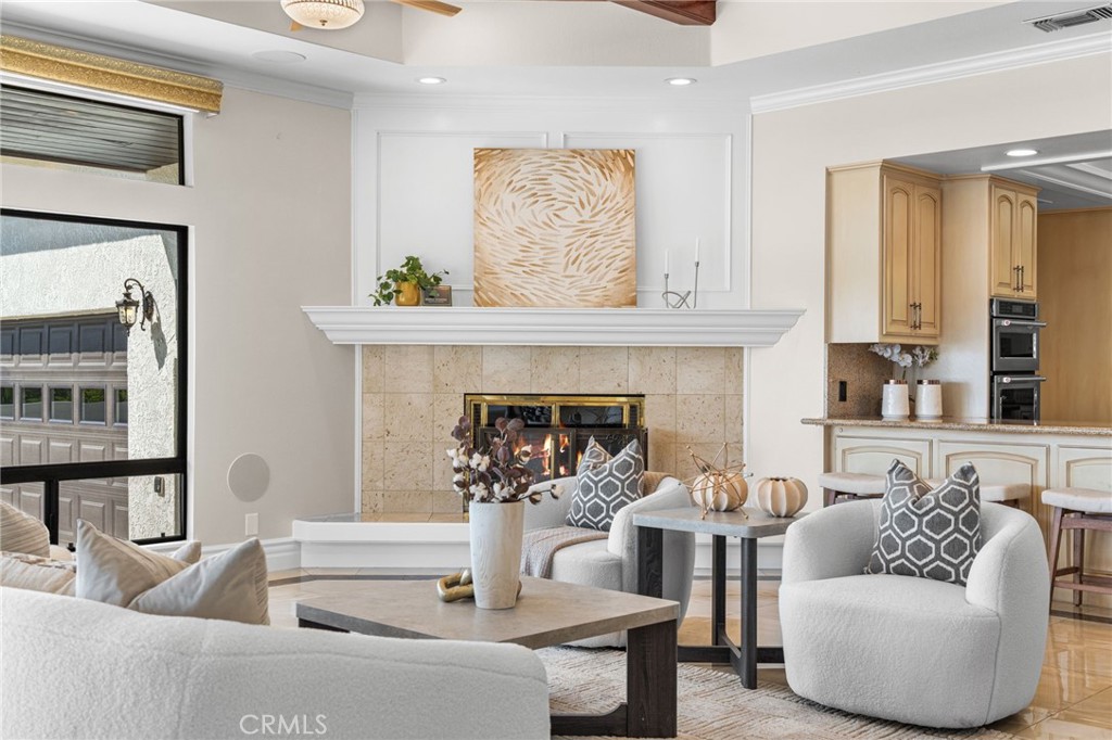 2487 Cliff Road Upland, CA 91784 - Photo 32 of 49 a living room with furniture and a fireplace