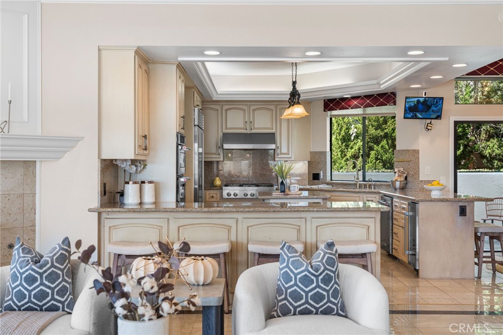 2487 Cliff Road Upland, CA 91784 - Photo 33 of 49 a kitchen with stainless steel appliances granite countertop a sink and cabinets