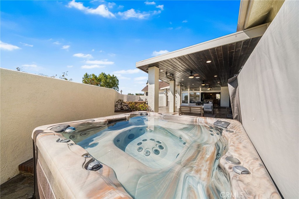 2487 Cliff Road Upland, CA 91784 - Photo 40 of 49 a view of kitchen with stainless steel appliances furniture stove refrigerator and couches with wooden floor