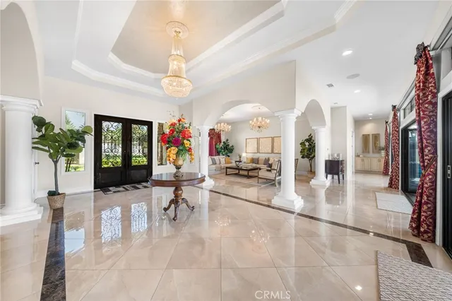 a view of a living room and chandelier