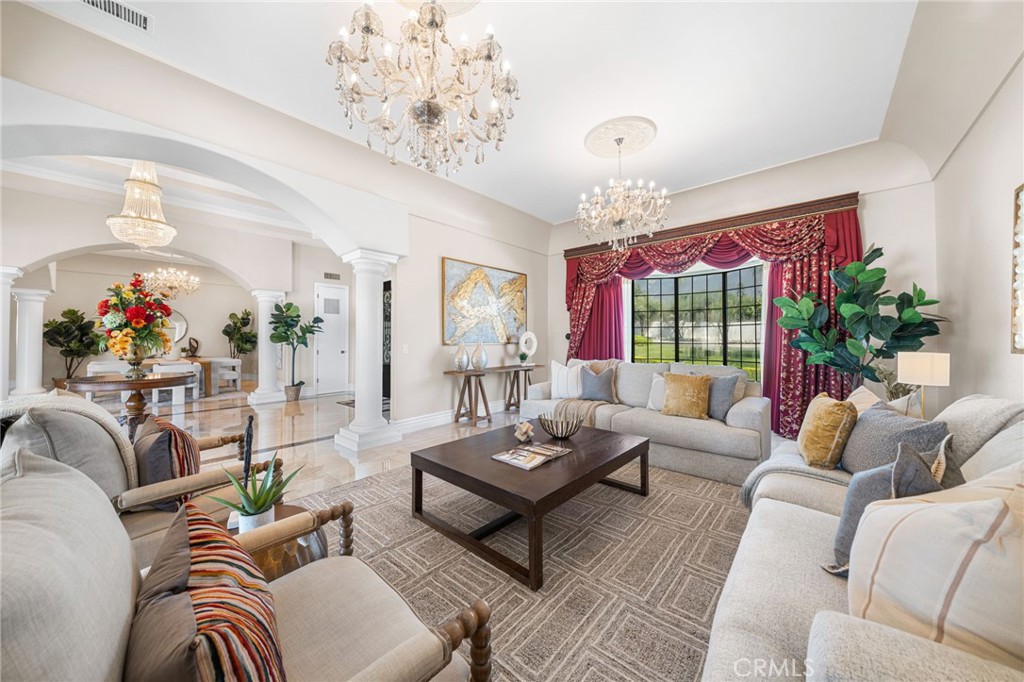 2487 Cliff Road Upland, CA 91784 - Photo 5 of 49 a living room with furniture and a chandelier