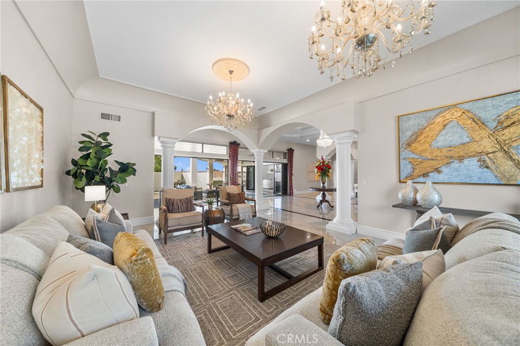 2487 Cliff Road Upland, CA 91784 - Photo 8 of 49 a living room with furniture a chandelier and a chandelier