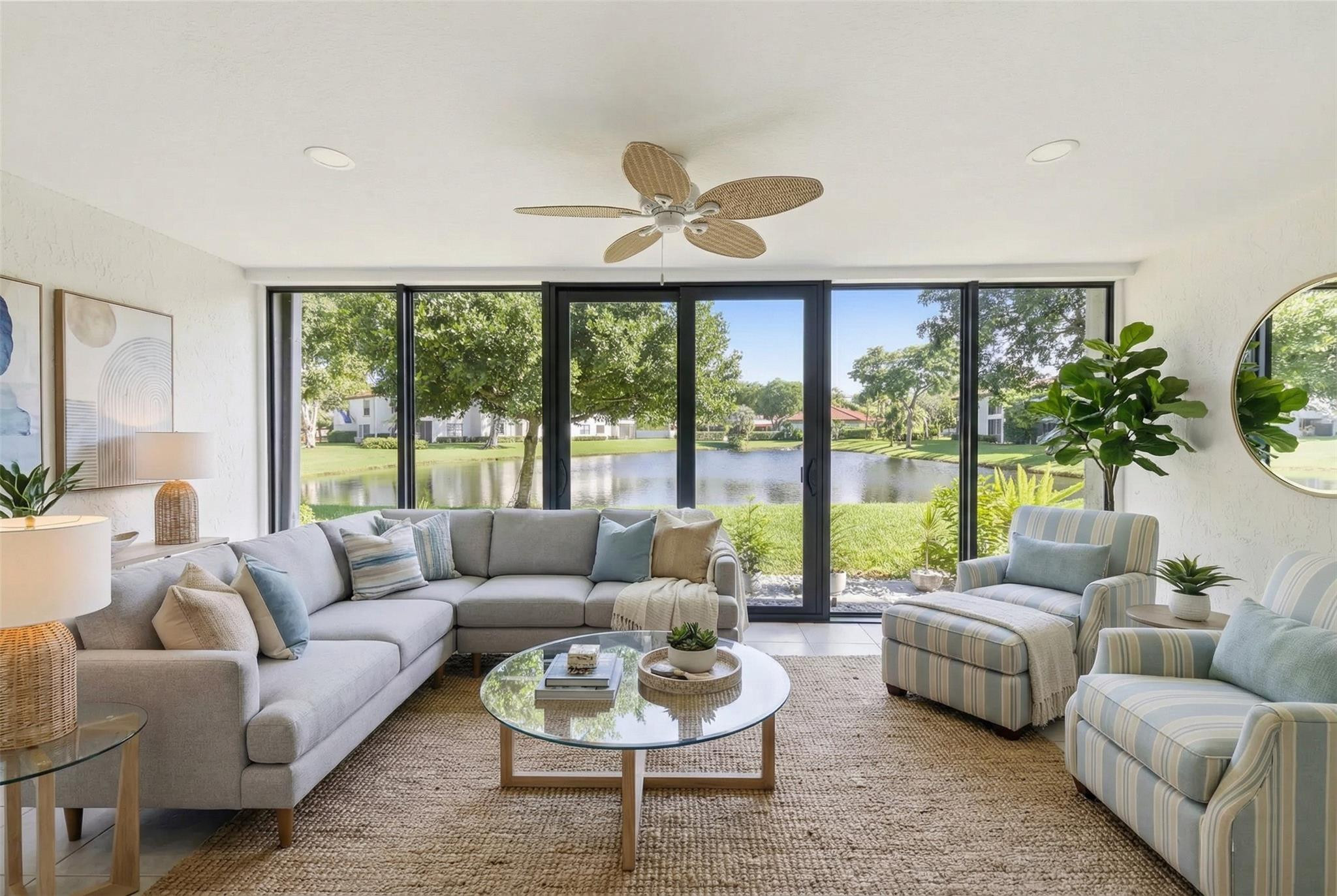 9232 Pecky Cypress Lane, Unit 2D Boca Raton, FL 33428 - Photo 10 of 20 a living room with furniture and a large window