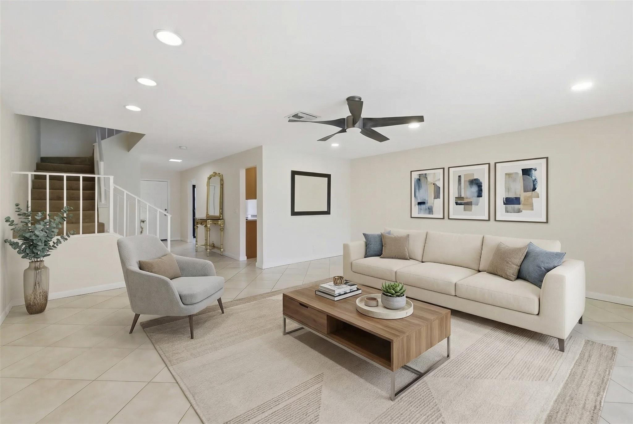 9232 Pecky Cypress Lane, Unit 2D Boca Raton, FL 33428 - Photo 12 of 20 a living room with furniture and a large window