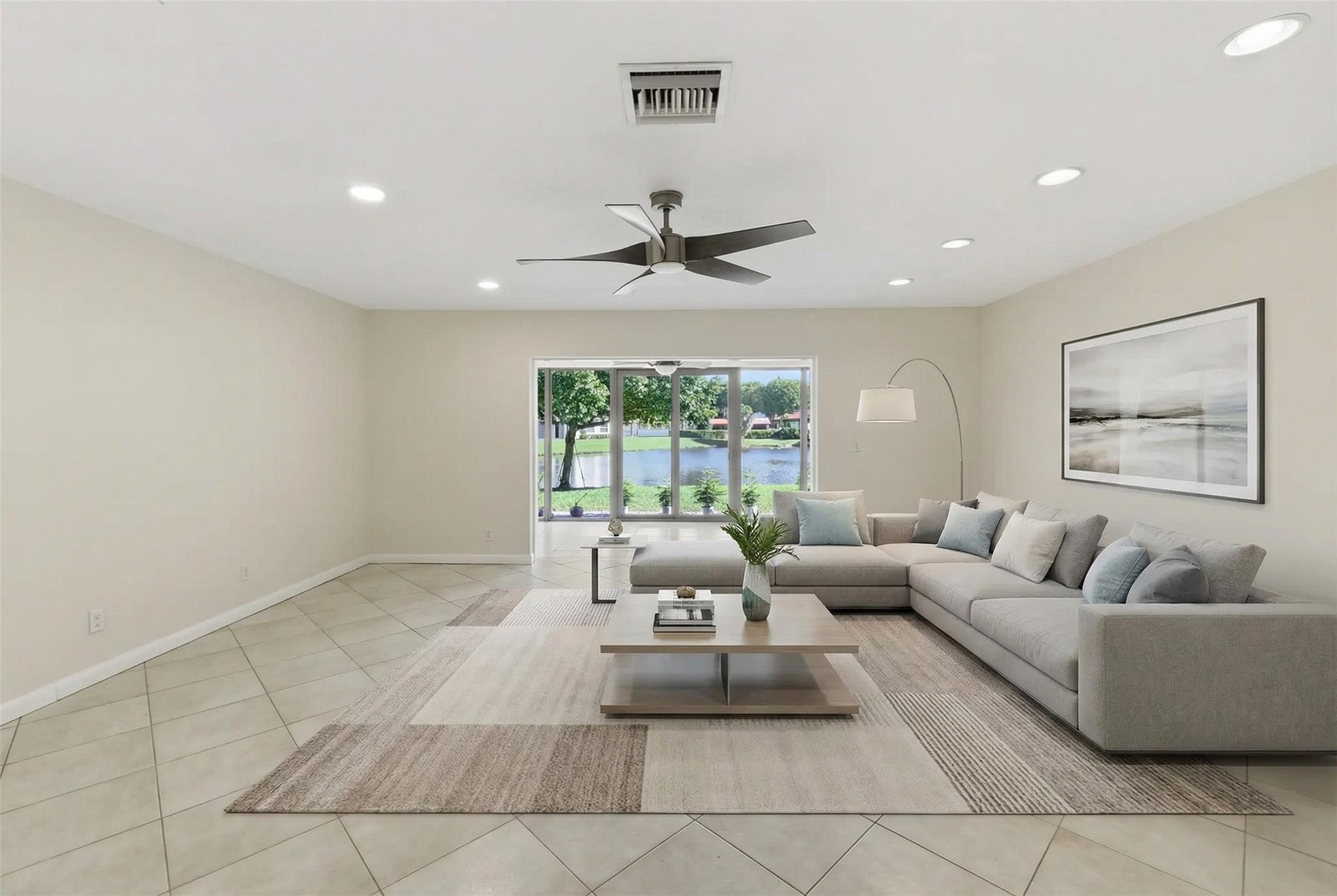 9232 Pecky Cypress Lane, Unit 2D Boca Raton, FL 33428 - Photo 14 of 20 a living room with furniture and a large window