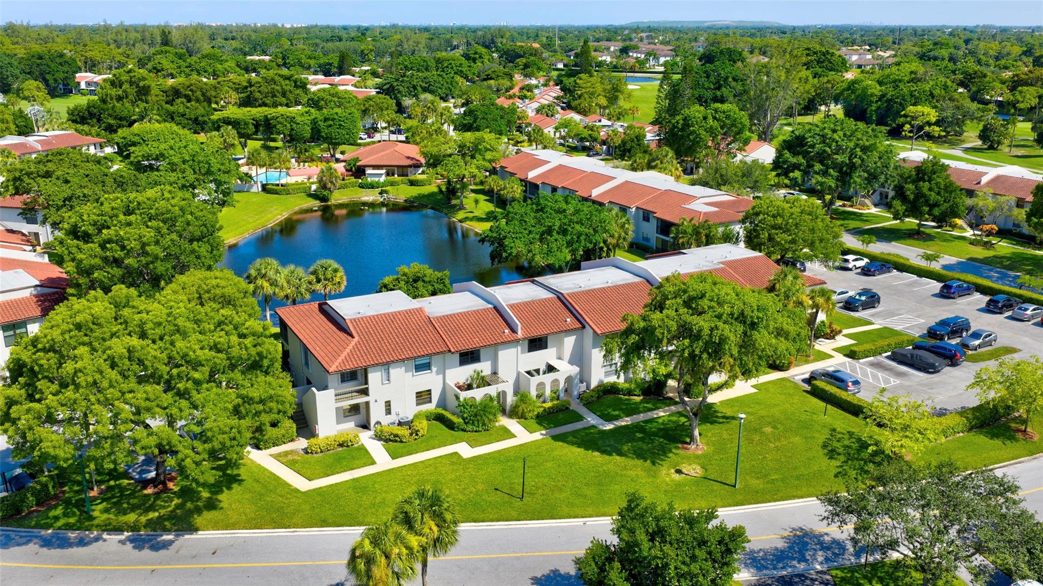 9232 Pecky Cypress Lane, Unit 2D Boca Raton, FL 33428 - Photo 18 of 20 an aerial view of residential houses with outdoor space and street view