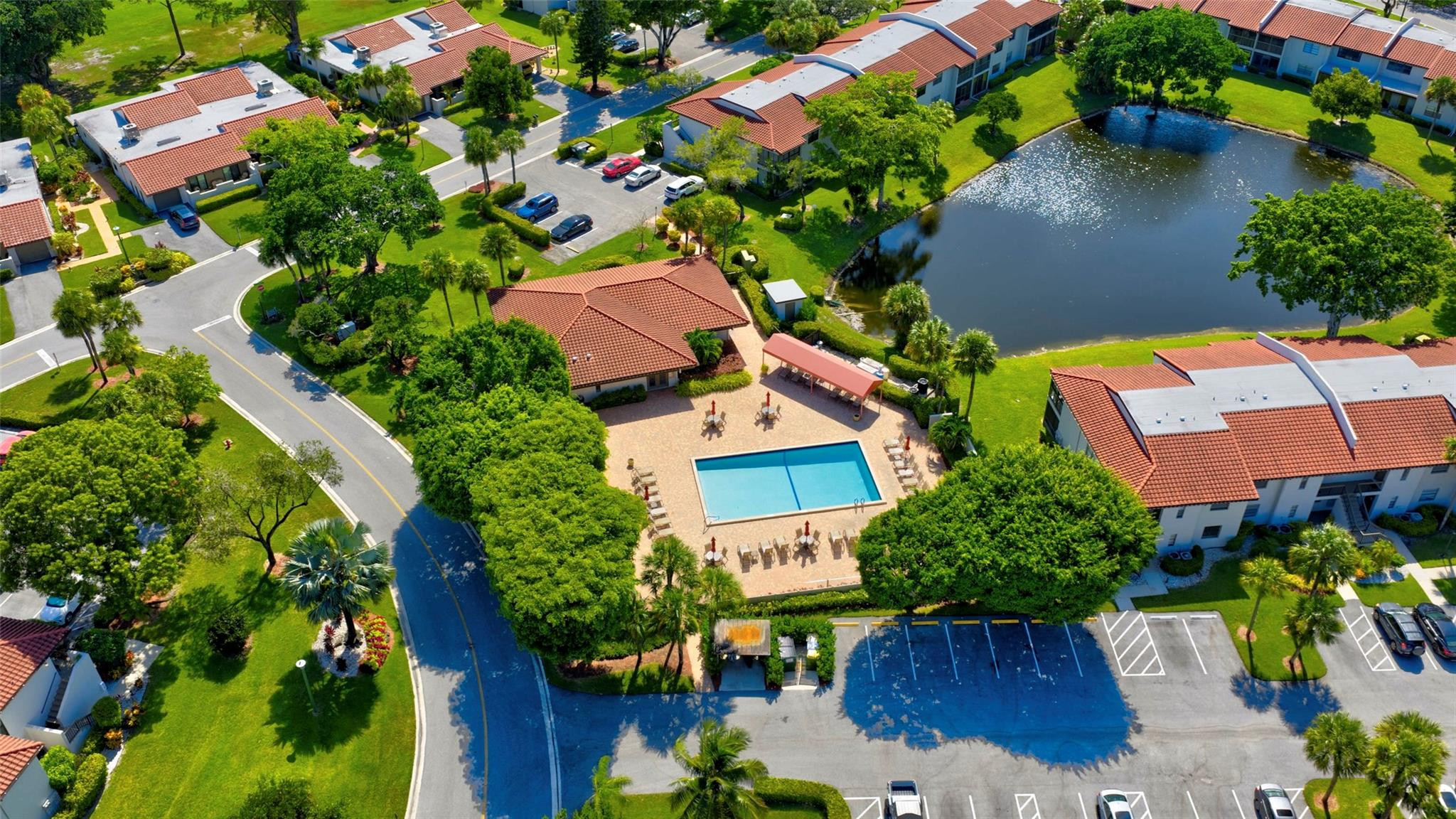 9232 Pecky Cypress Lane, Unit 2D Boca Raton, FL 33428 - Photo 19 of 20 an aerial view of a house with swimming pool and garden