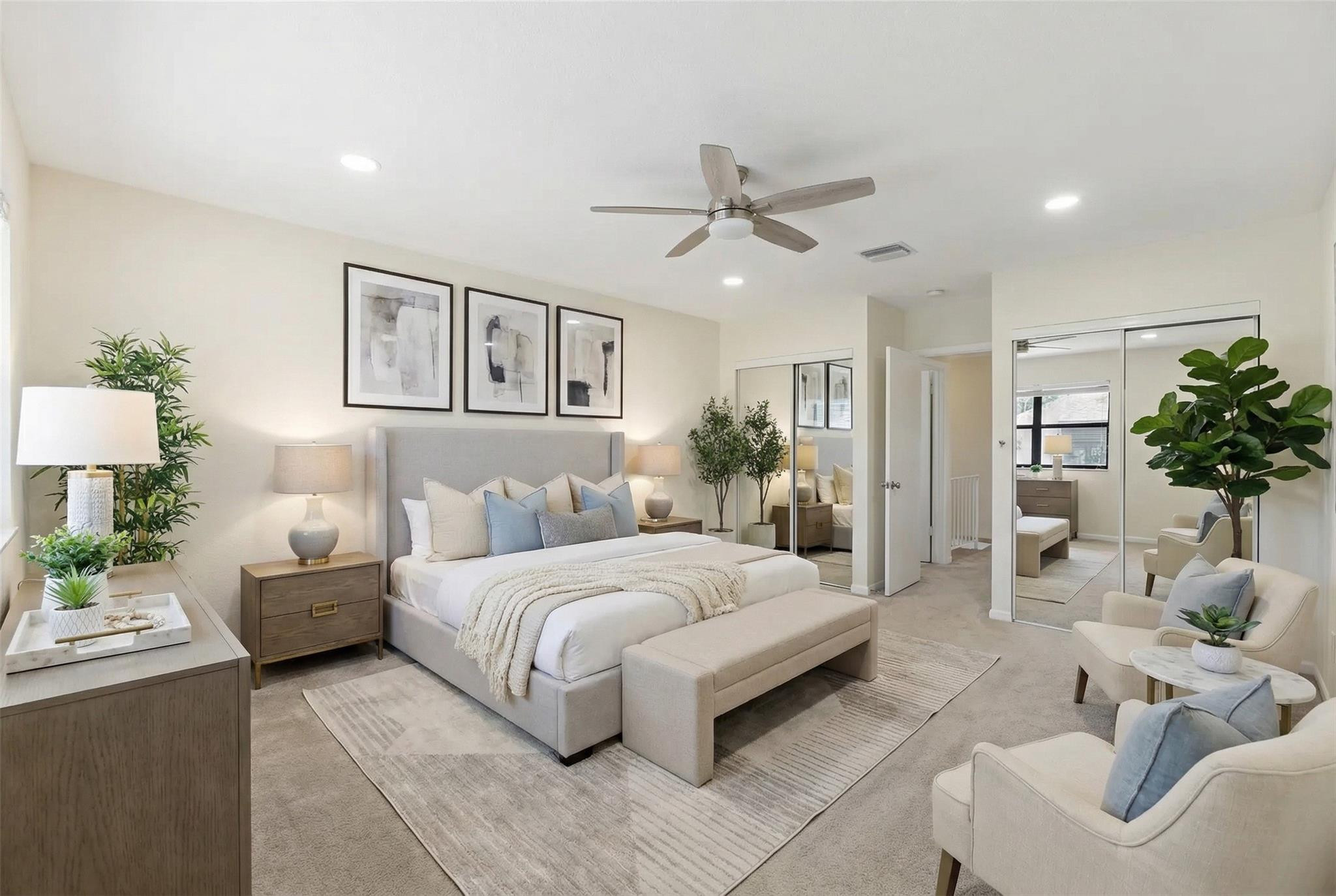 9232 Pecky Cypress Lane, Unit 2D Boca Raton, FL 33428 - Photo 4 of 20 a bedroom with a large bed and a chandelier