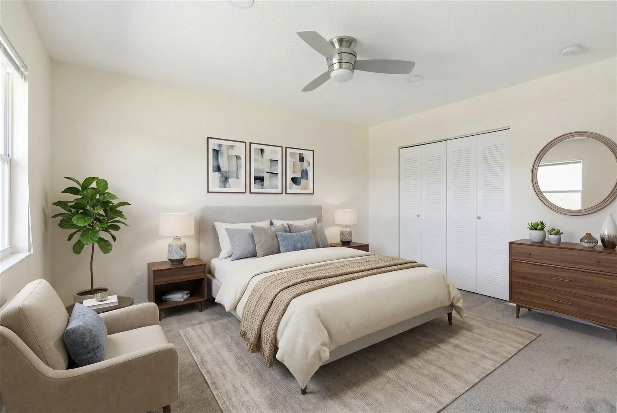 9232 Pecky Cypress Lane, Unit 2D Boca Raton, FL 33428 - Photo 5 of 20 a bedroom with bed and a couch