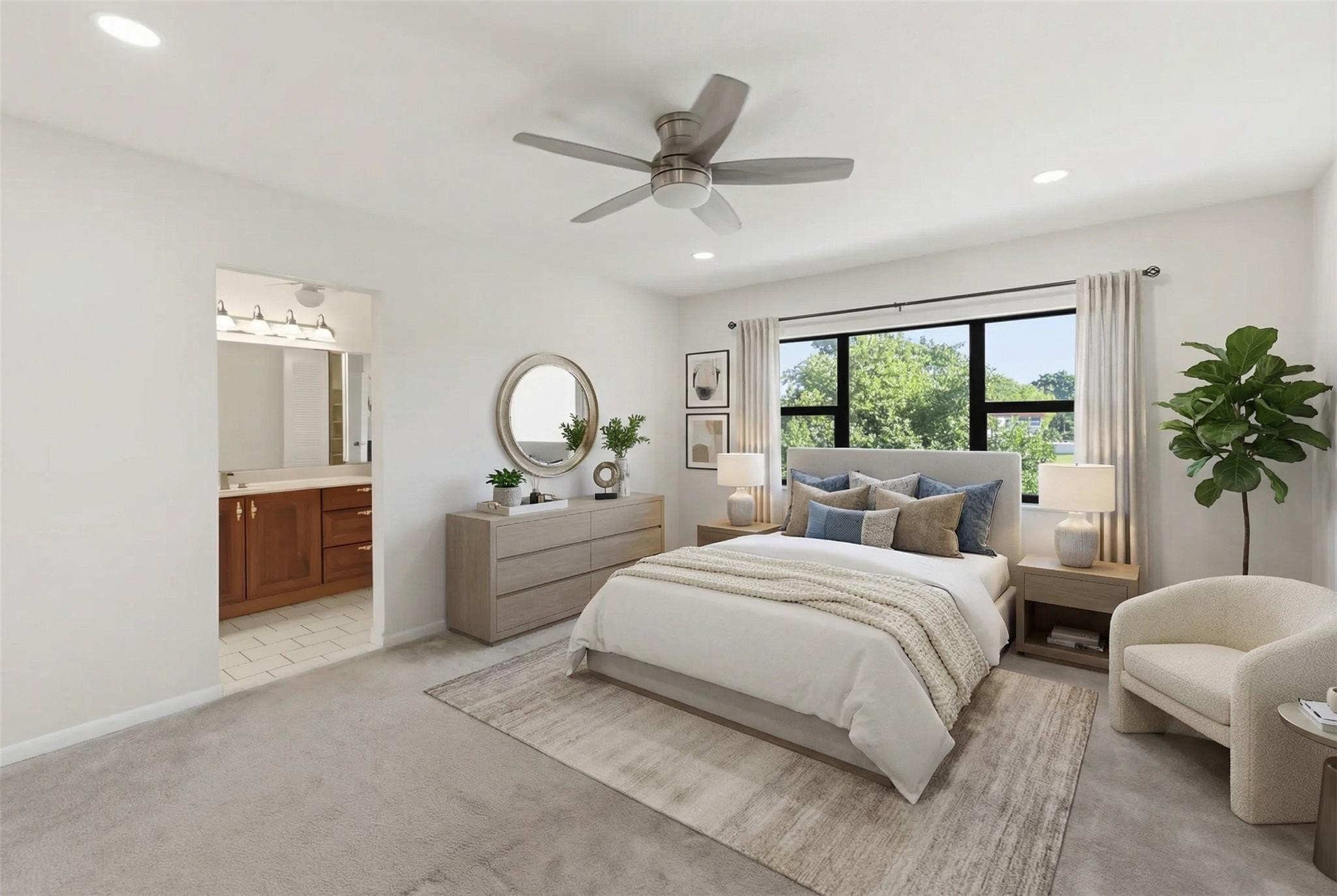 9232 Pecky Cypress Lane, Unit 2D Boca Raton, FL 33428 - Photo 7 of 20 a bedroom with a large bed and a large window