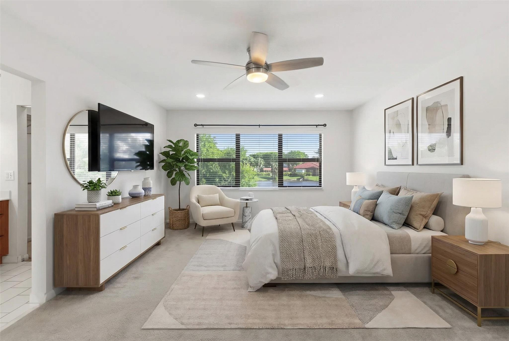 9232 Pecky Cypress Lane, Unit 2D Boca Raton, FL 33428 - Photo 8 of 20 a spacious bedroom with a large bed and a large window