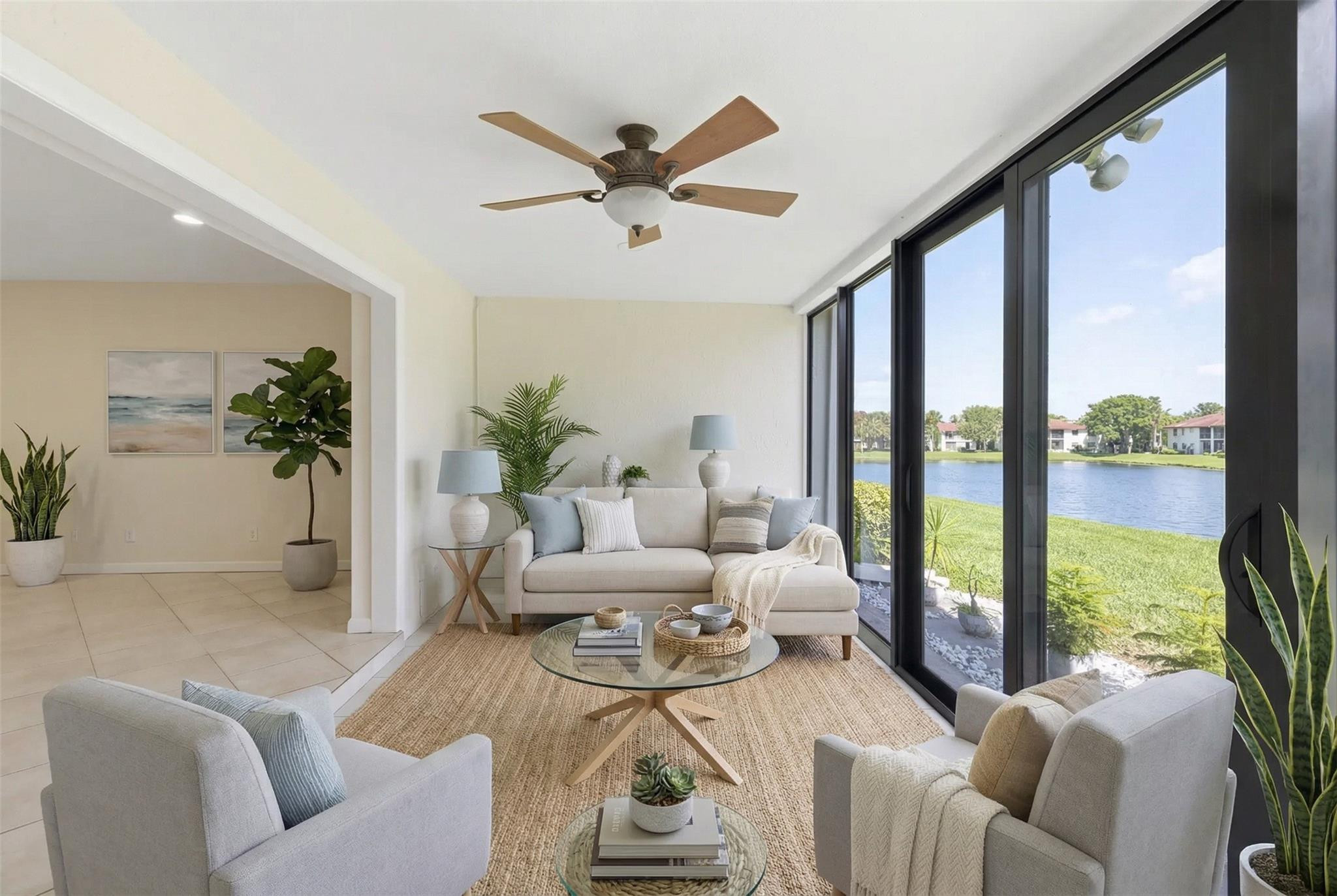 9232 Pecky Cypress Lane, Unit 2D Boca Raton, FL 33428 - Photo 9 of 20 a living room with furniture and a large window