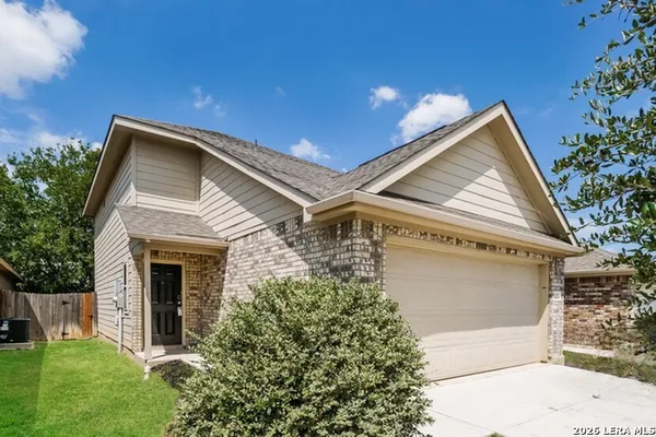 a view of house with garden
