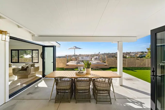 a view of a backyard with sitting area