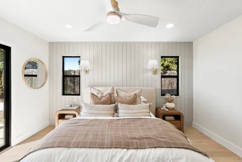 a bathroom with a glass shower door
