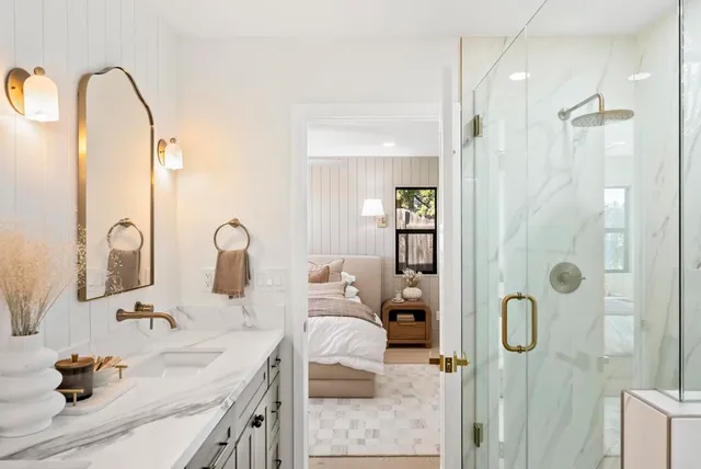 an empty room with wooden floor and ceiling fan