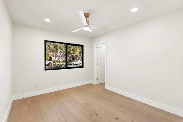 a bathroom with a toilet and a mirror