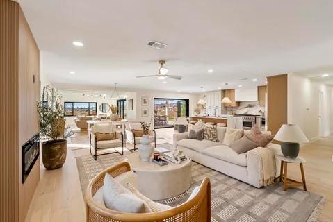 a large kitchen with a table and chairs