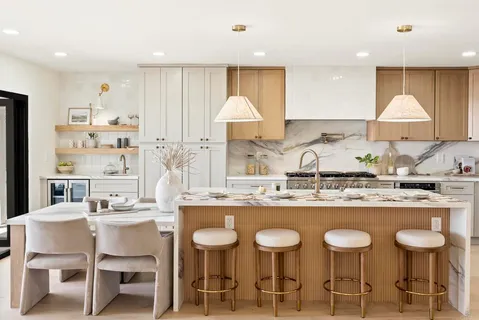 a large kitchen with a table and chairs