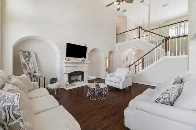 a living room with furniture fireplace and a flat screen tv