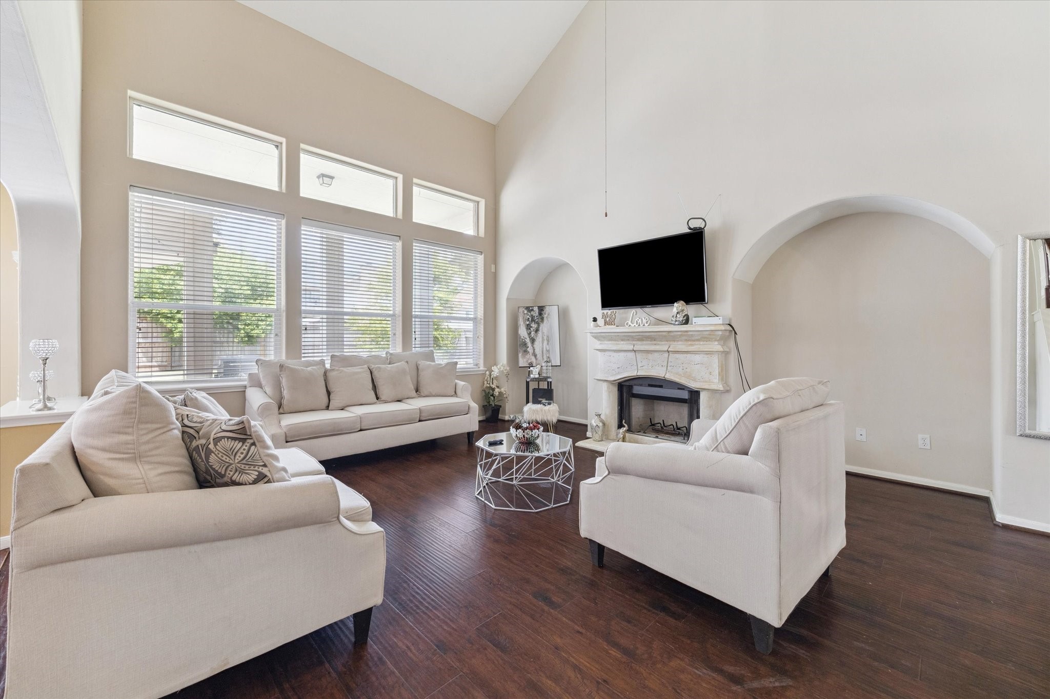 6306 Amelia Springs Drive Spring, TX 77379 - Photo 12 of 37 a living room with furniture a fireplace and a flat screen tv