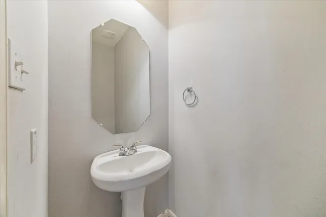 a bathroom with a sink and mirror