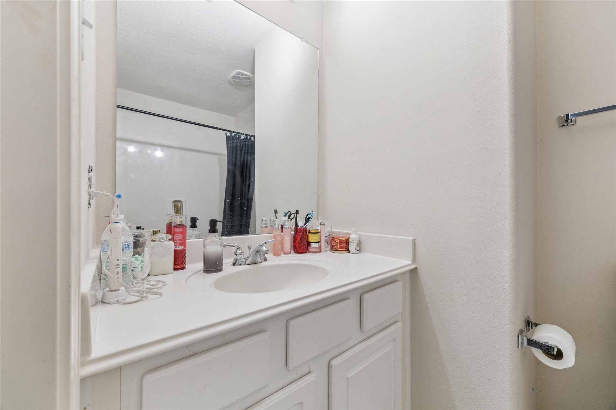 6306 Amelia Springs Drive Spring, TX 77379 - Photo 20 of 37 a bathroom with a sink and a mirror