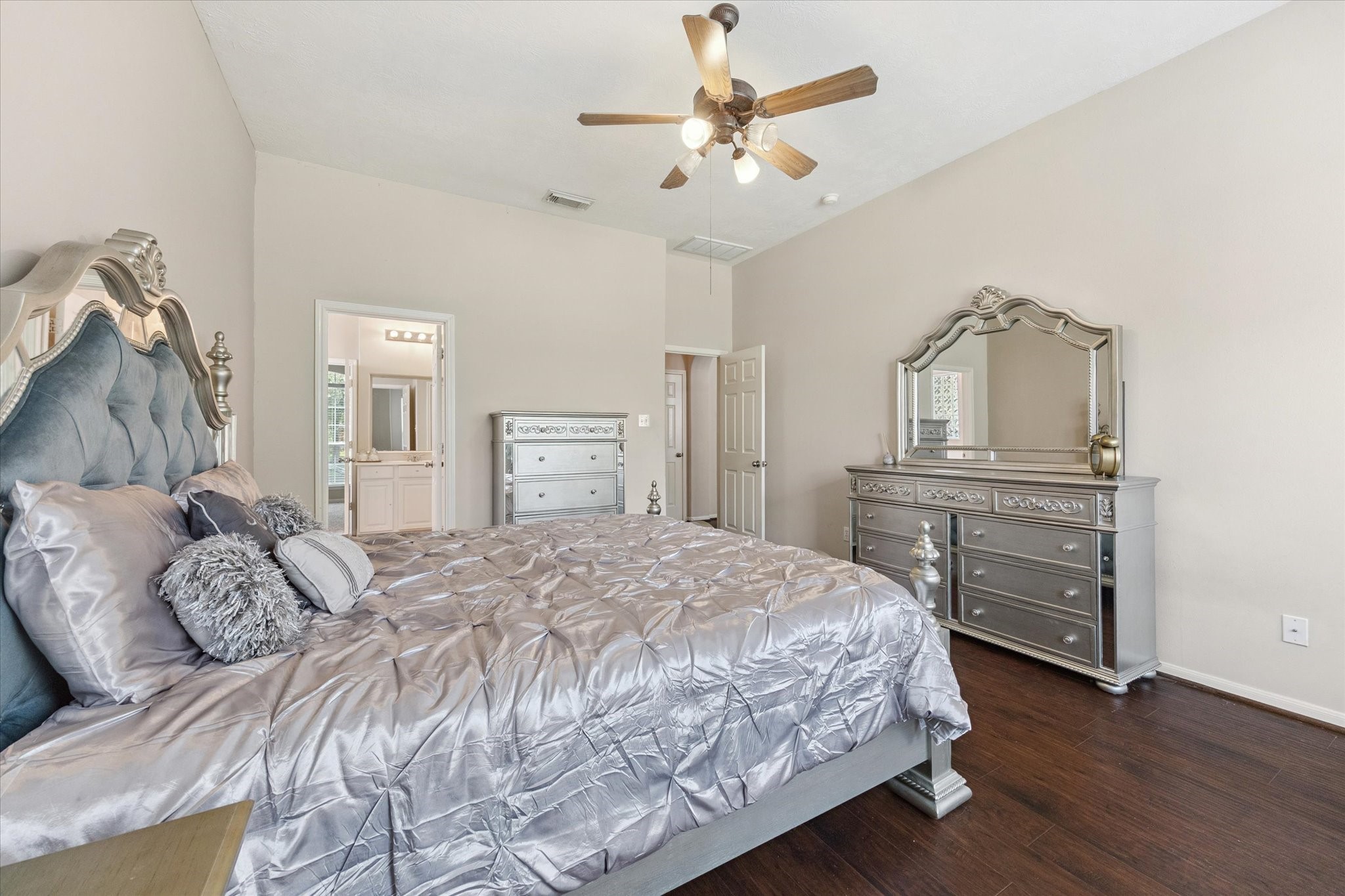 6306 Amelia Springs Drive Spring, TX 77379 - Photo 22 of 37 a bedroom with a bed and wooden floor