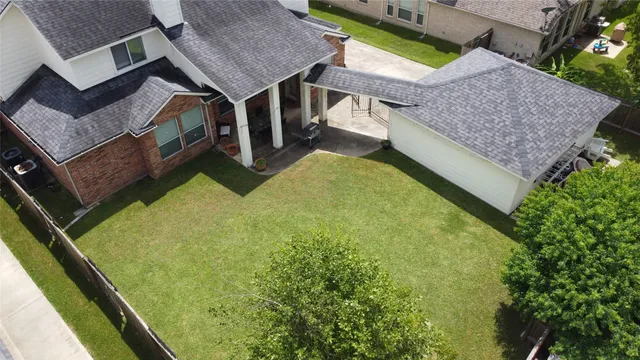 an aerial view of a house with swimming pool