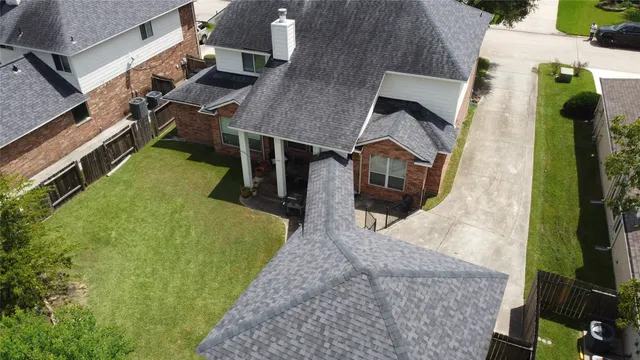 an aerial view of a house having patio