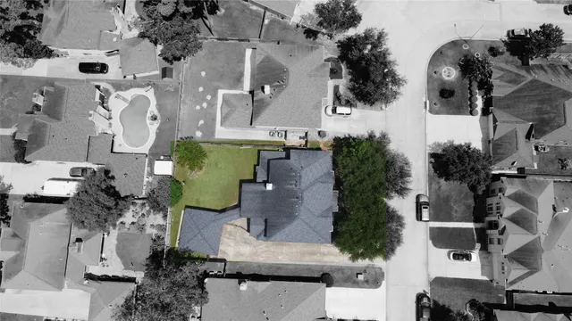 an aerial view of multiple houses with outdoor space