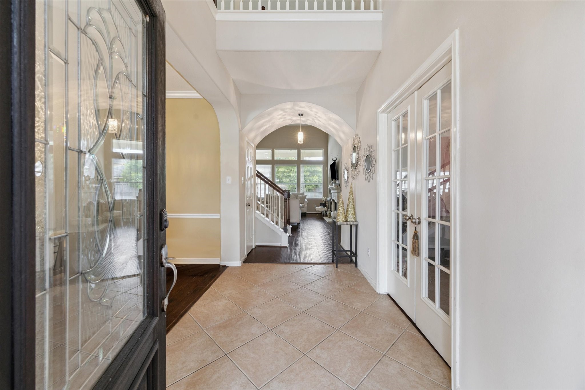 6306 Amelia Springs Drive Spring, TX 77379 - Photo 4 of 37 a view of a hallway with wooden floor and windows