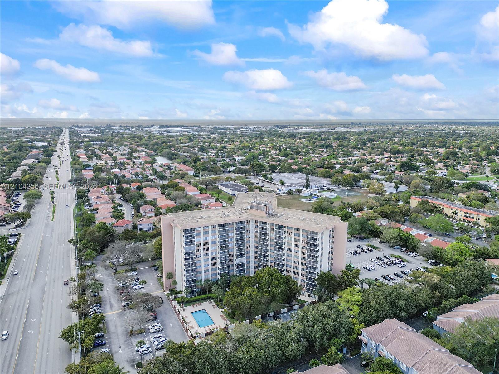 10777 West Sample Road, Unit 907 Coral Springs, FL 33065 - Photo 25 of 45 Facing West on Sample Rd.