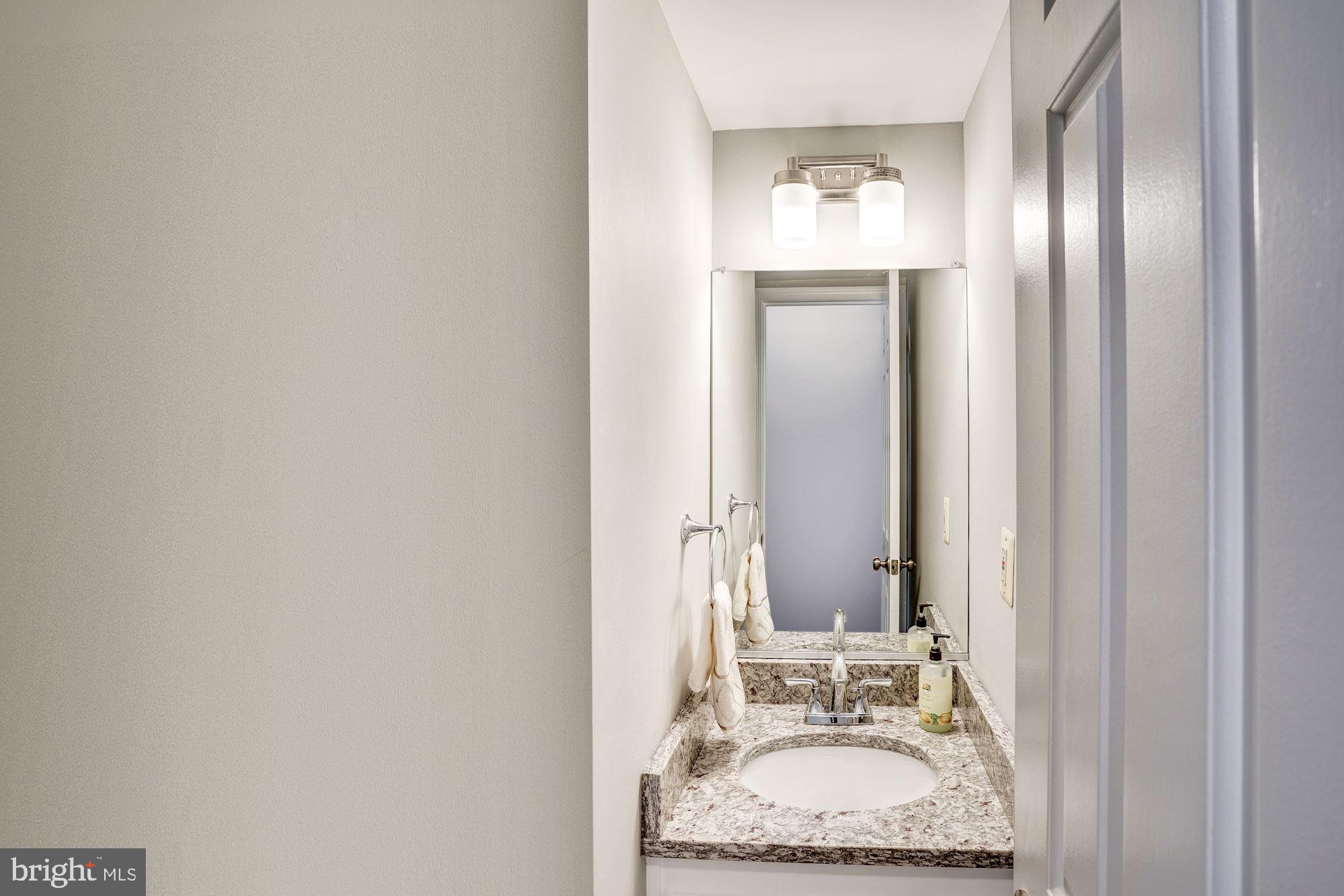 2986 Emerald Chase Drive Herndon, VA 20171 - Photo 18 of 36 Remodeled half bath w/ granite counter top