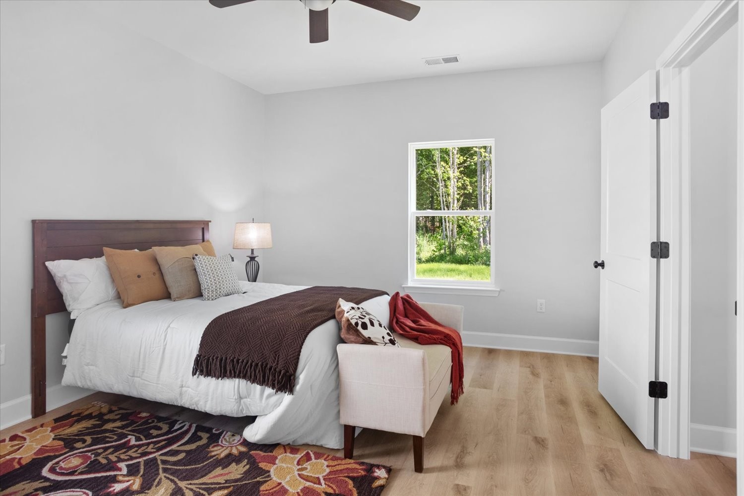 144 Eno Road Dickson, TN 37055 - Photo 12 of 15 a bedroom with a bed and wooden floor
