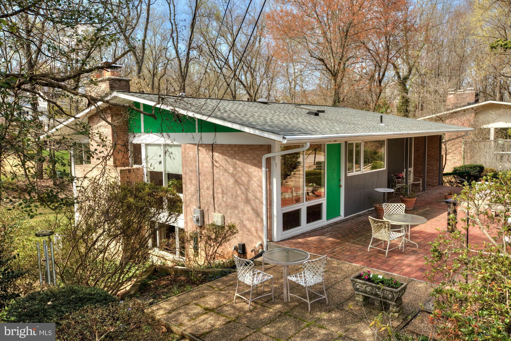 3916 Rickover Road Silver Spring, MD 20902 - Photo 1 of 23 a view of a patio with table and chairs and potted plants