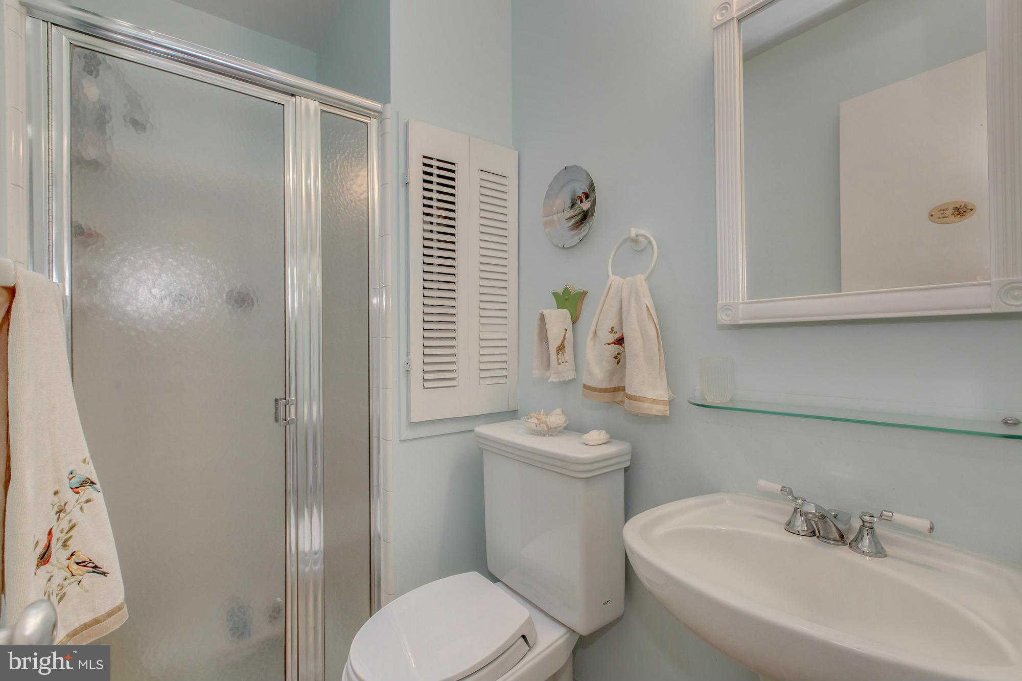 3916 Rickover Road Silver Spring, MD 20902 - Photo 13 of 23 a white toilet sitting next to a bathroom sink