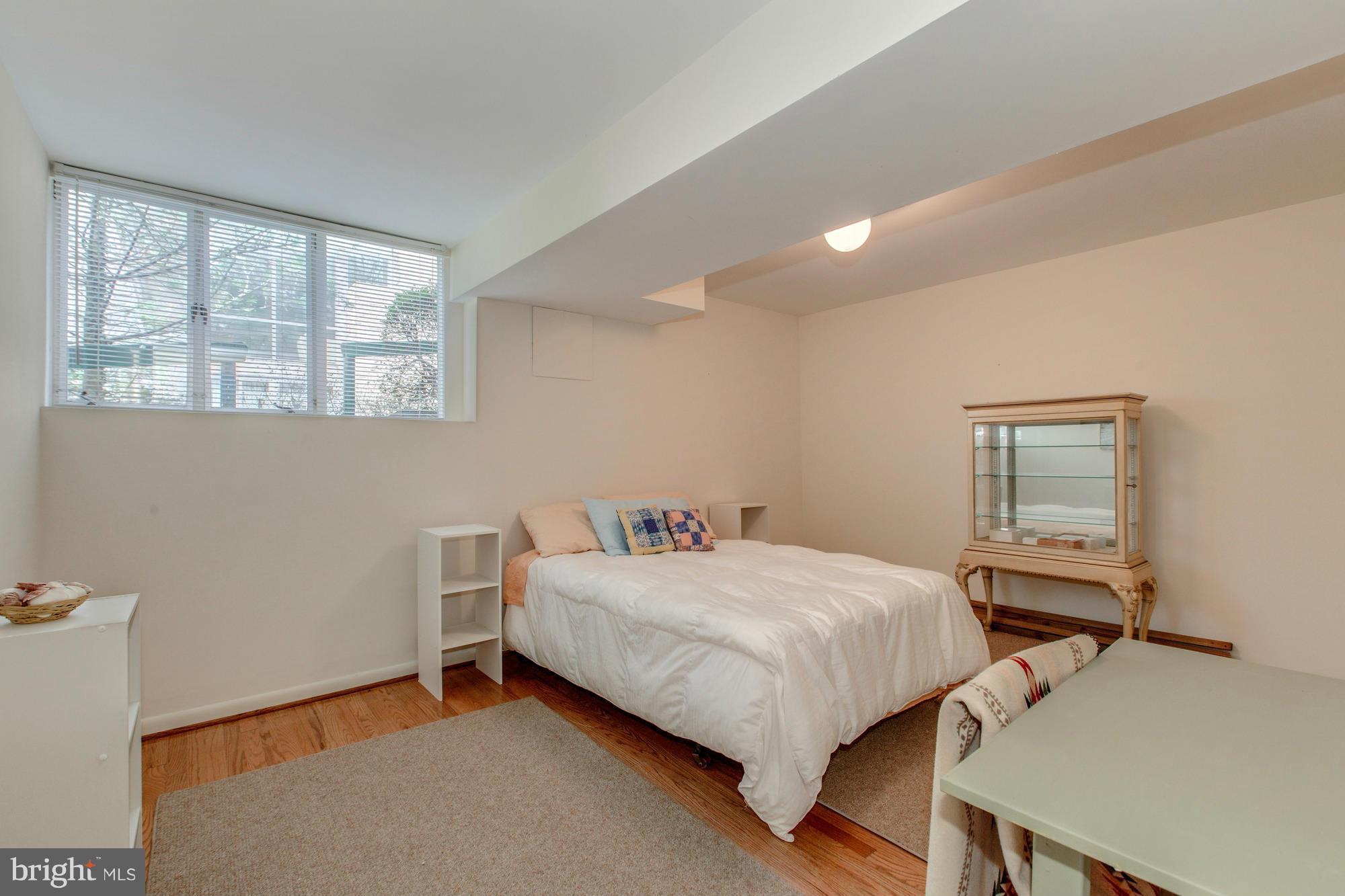 3916 Rickover Road Silver Spring, MD 20902 - Photo 19 of 23 a bedroom with a bed and window