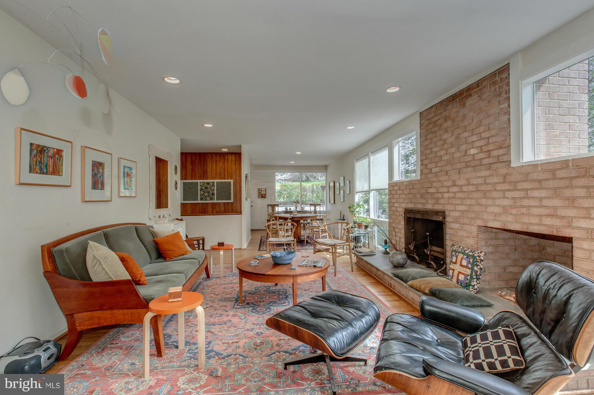 3916 Rickover Road Silver Spring, MD 20902 - Photo 4 of 23 a living room with furniture and a fireplace