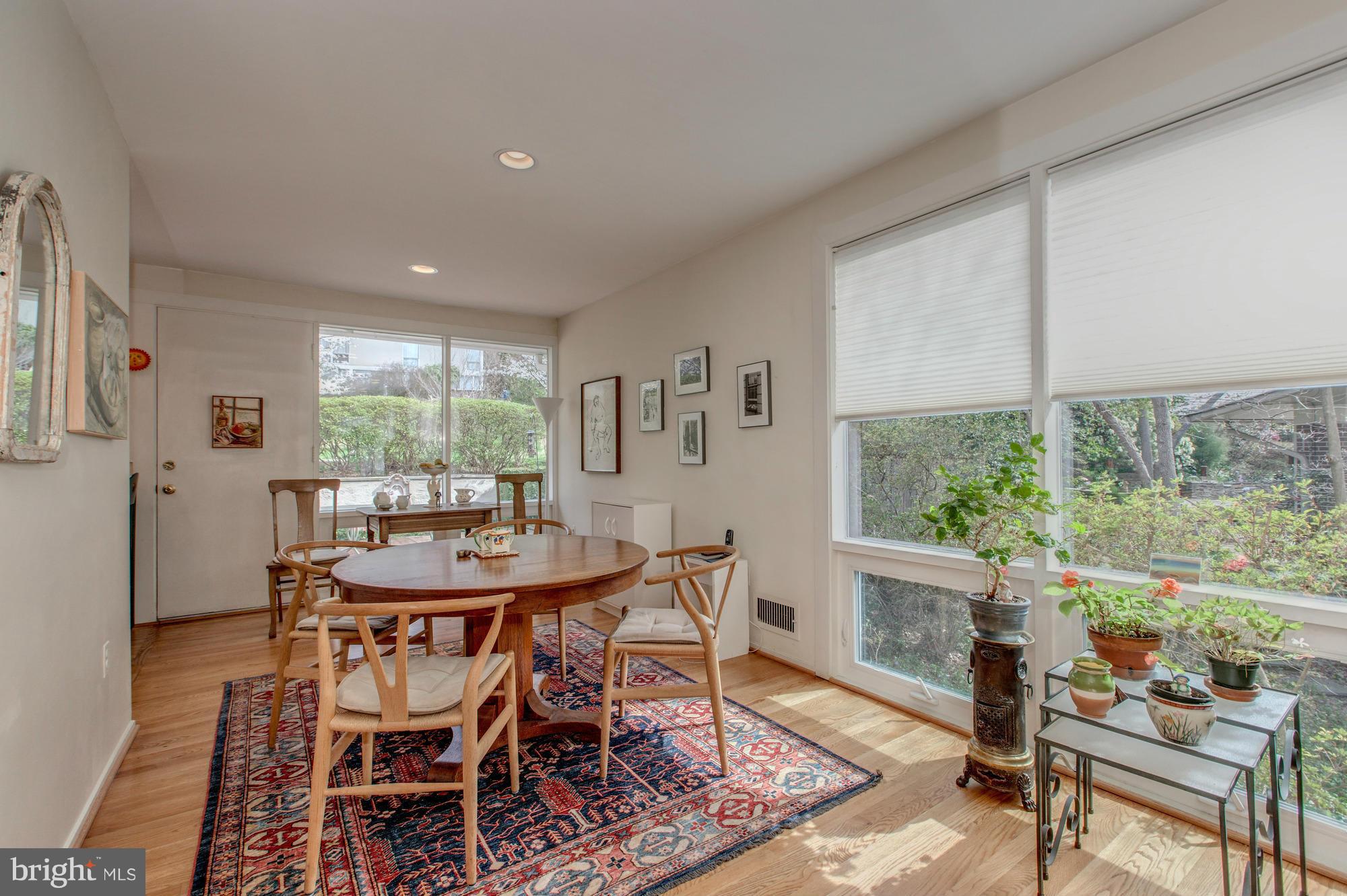 3916 Rickover Road Silver Spring, MD 20902 - Photo 5 of 23 a dining room with furniture a rug and wooden floor