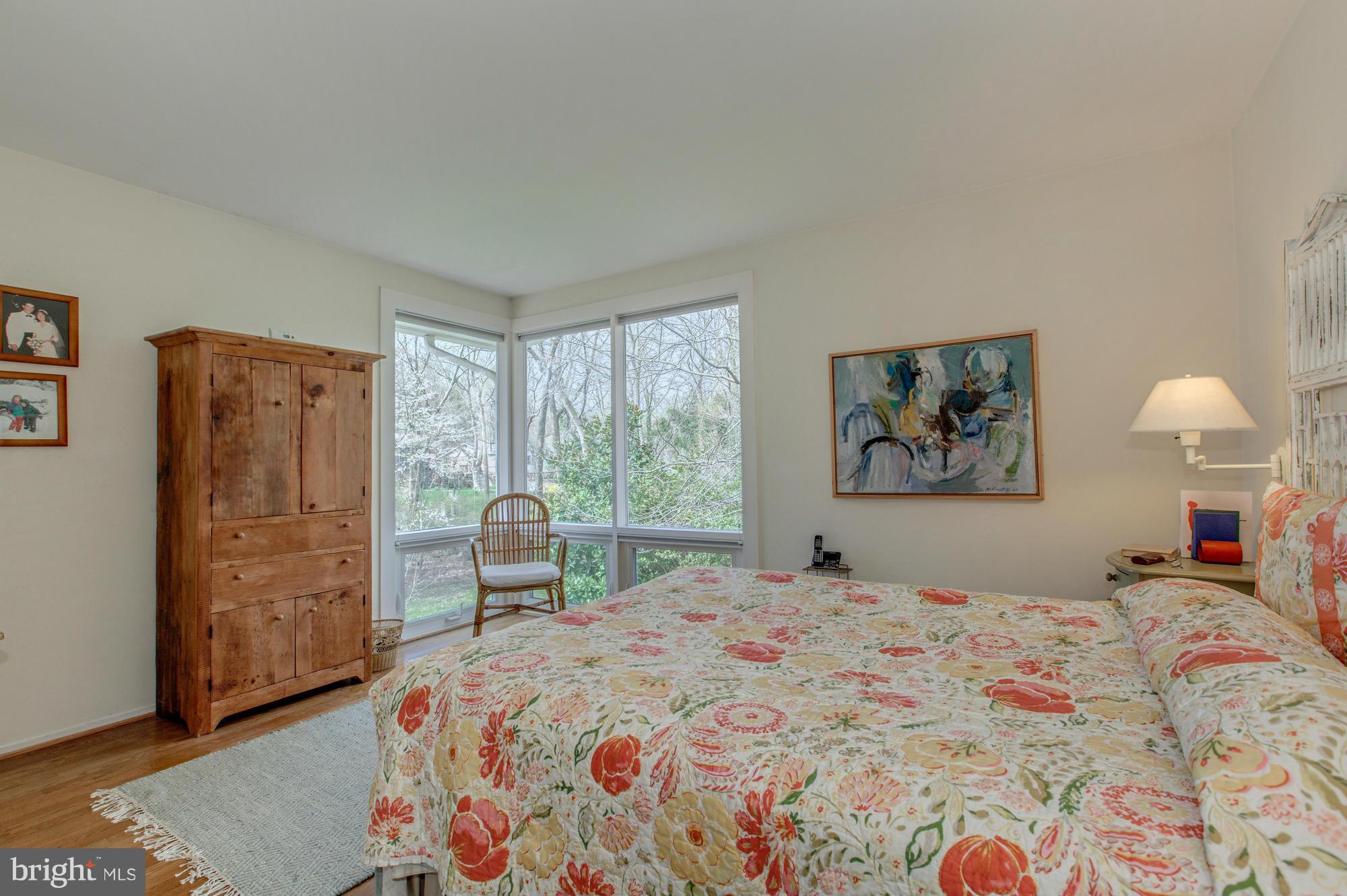 3916 Rickover Road Silver Spring, MD 20902 - Photo 10 of 23 a bedroom with a bed and a painting on the wall