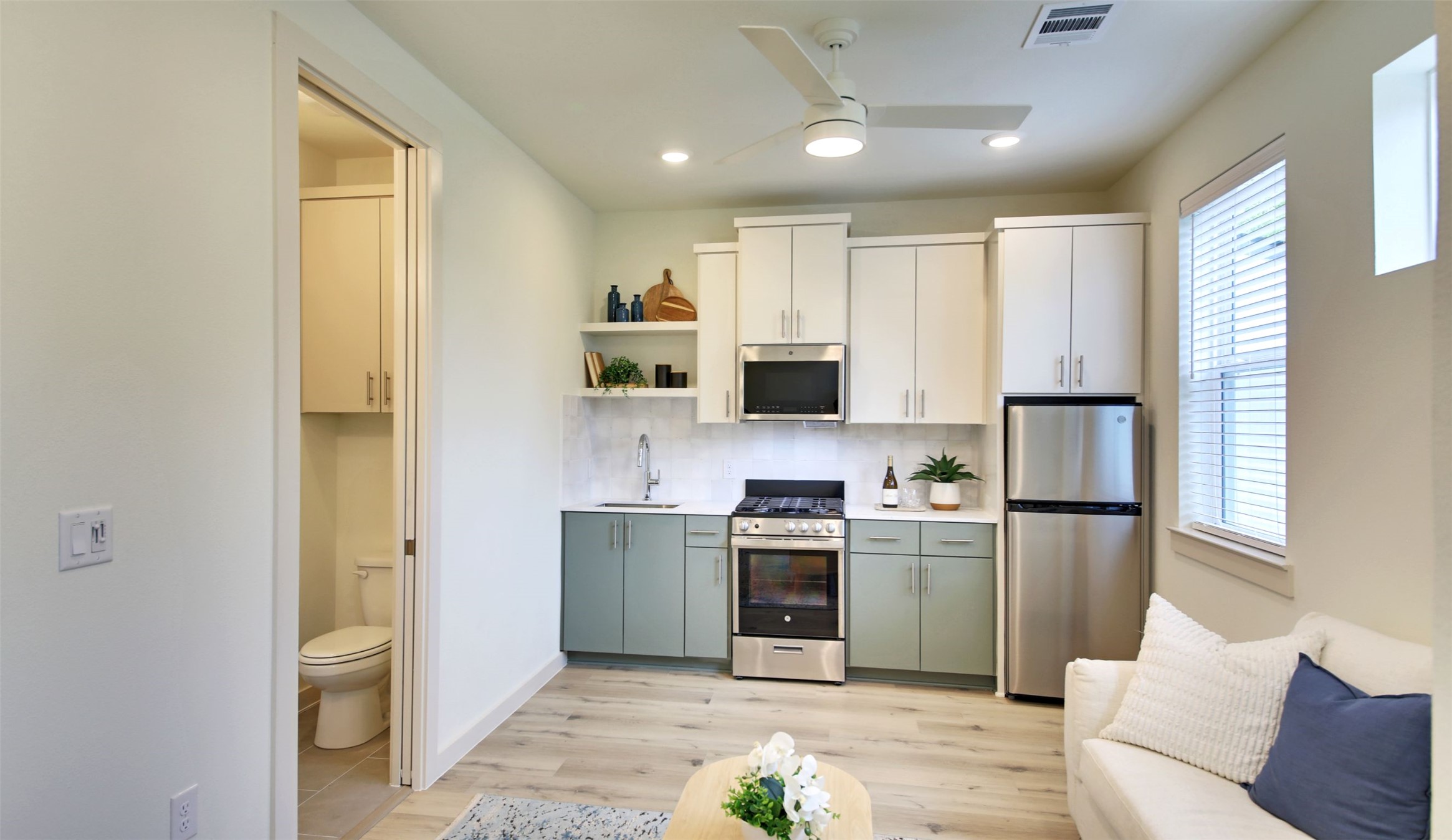 6802 Montana Street, Unit 2 Austin, TX 78741 - Photo 5 of 13 A compact, efficient kitchen with stainless steel appliances and contemporary cabinetry.