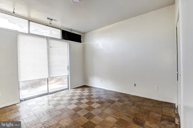 a view of an empty room with a window