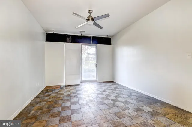 a view of an empty room with a window