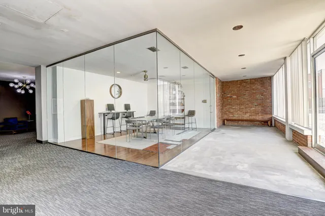 a view of a room with gym equipment and a large window