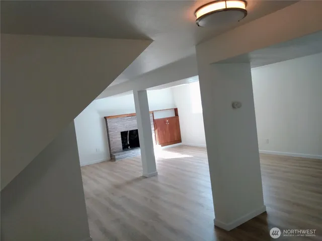 a view of a livingroom with wooden floor