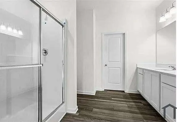 a view of a bathroom from the hallway