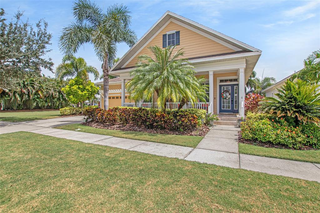 5733 Tortoise Place Apollo Beach, FL 33572 - Photo 1 of 1 a front view of house with yard and green space
